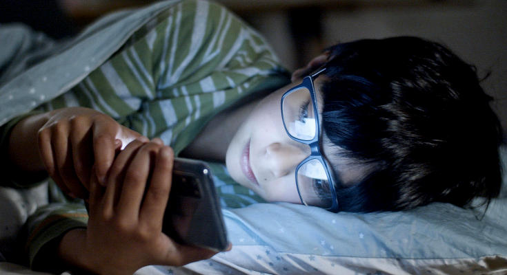 boy sleeping with phone